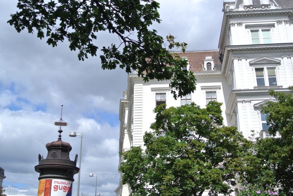 White building and kiosk in Vienna