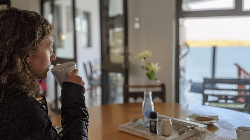 Woman drinking coffee in hotel in Lüderitz Namibia