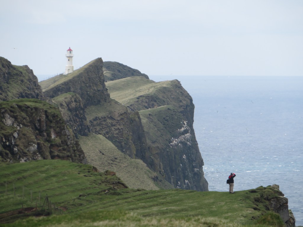 Man photo cliff lighthouse mountains water