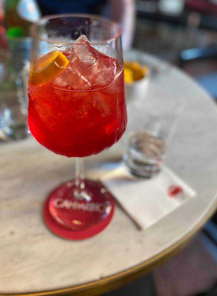 A Campari Spritz at Camparino bar in Galleria Vittorio Emanuele in Milan, Italy