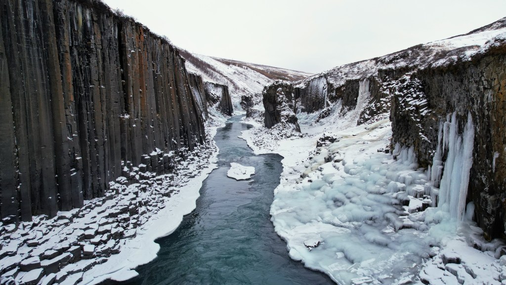 A drone shot from inside Studagil canyon, which is known for its columnar basalt, in eastern Iceland